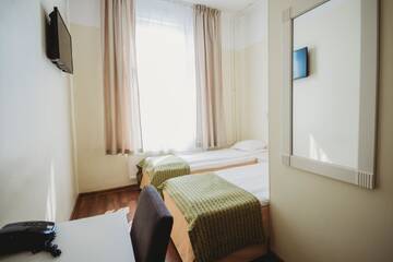 Фото номера Двухместный номер с 2 отдельными кроватями Отель Economy Hotel г. Таллин 10